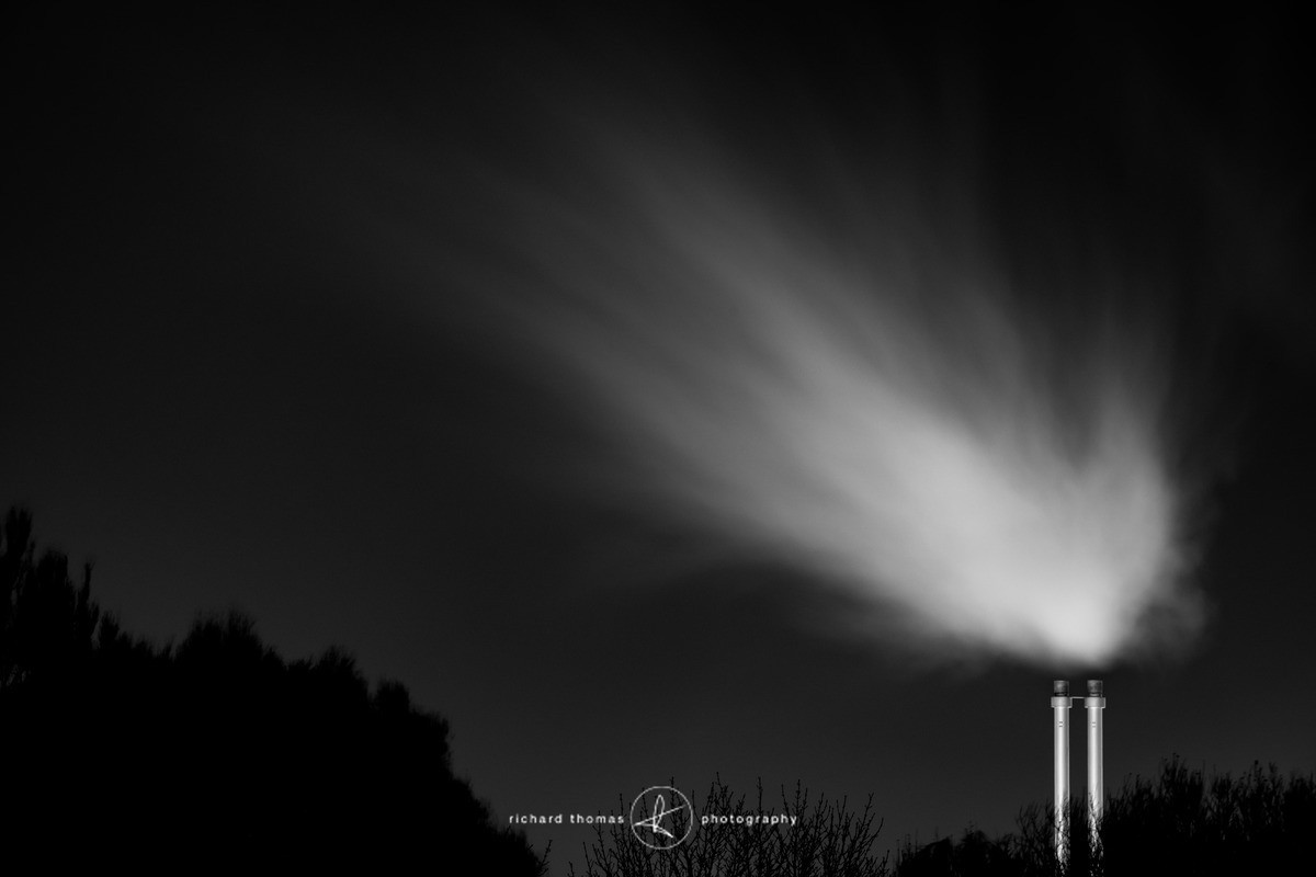 Industrial chimneys at night
