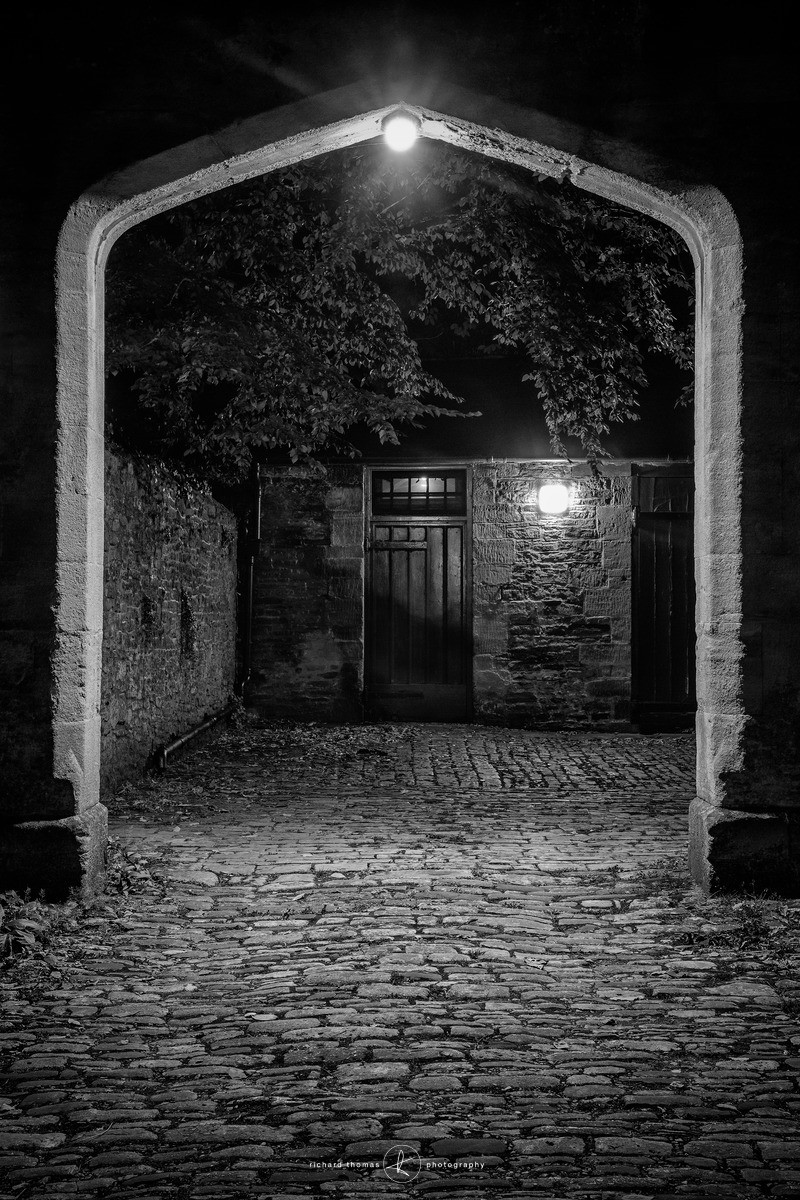 A cobbled courtyrad in Wells Somerset at night