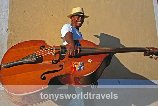 Man with bass smiling Trinidad, Cuba - Smiling faces of the World