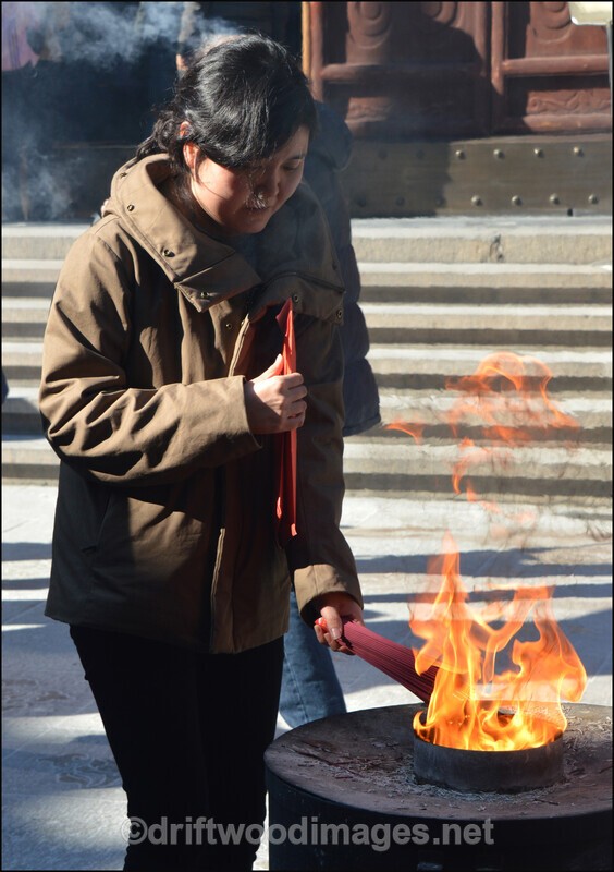 China Shanghai Temple girl by flame 3 - China