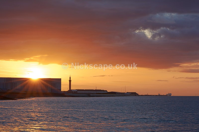 Photo of Grismby Docks and Tower from Cleethorpes at sunset | Photography by Nickscape