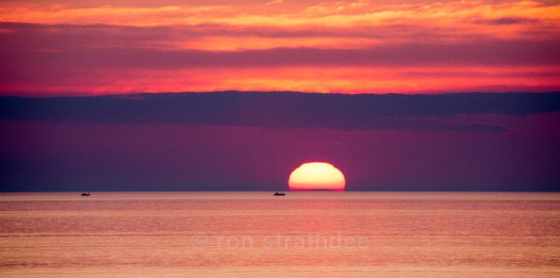 Sunset and the fishing boat - Skies of Man