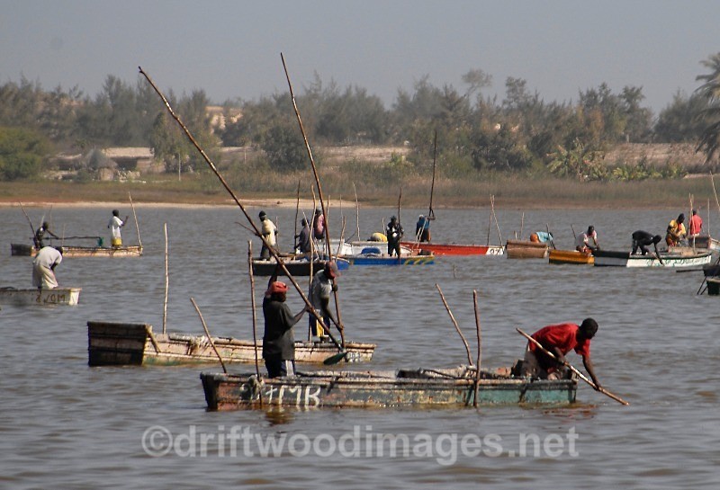 Senegal Lac Rose salt production boats on lake 2 - Senegal Salt Production at Lac Rose