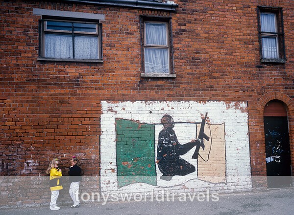 Two Children chatting next to a Belfast Mural, Ireland 1994 - Children